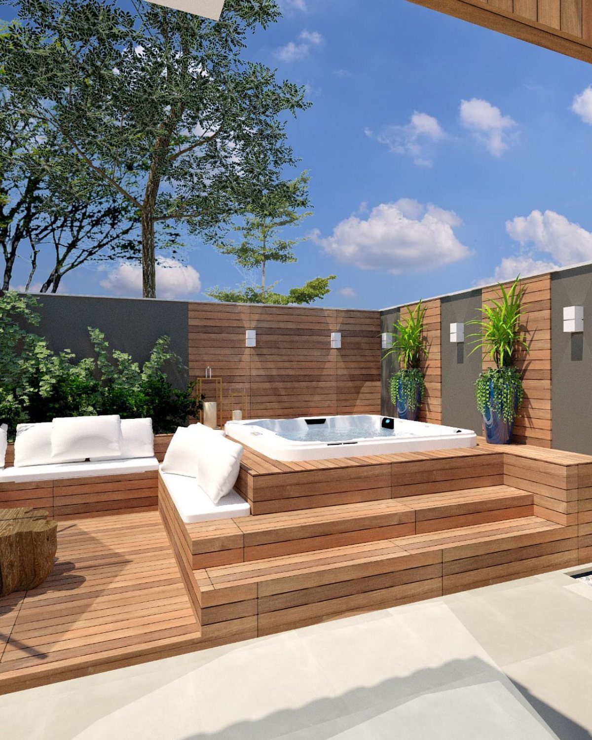 Modern wooden deck with built-in hot tub, integrated steps, and white cushioned seating area.