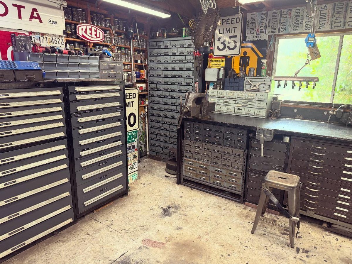 Garage Workbench Ideas: 11 Builds from IKEA Hacks to Heavy-Duty 8 Metal tool chests and organized workbench drawers in a cluttered garage workshop setting.