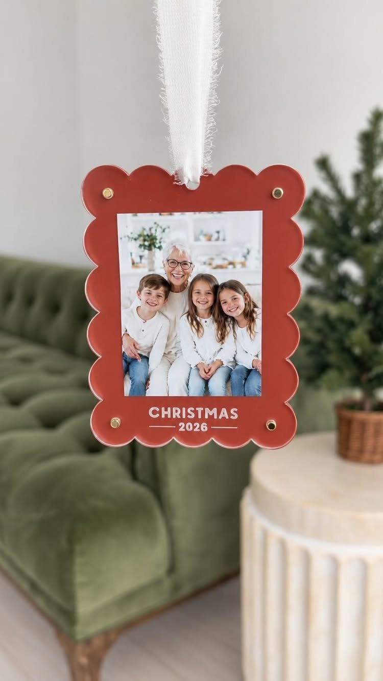 Homemade Christmas Ornament Ideas: 8 Easy Projects 2 Red scalloped ornament hanging by a white ribbon featuring a family photograph and Christmas text.
