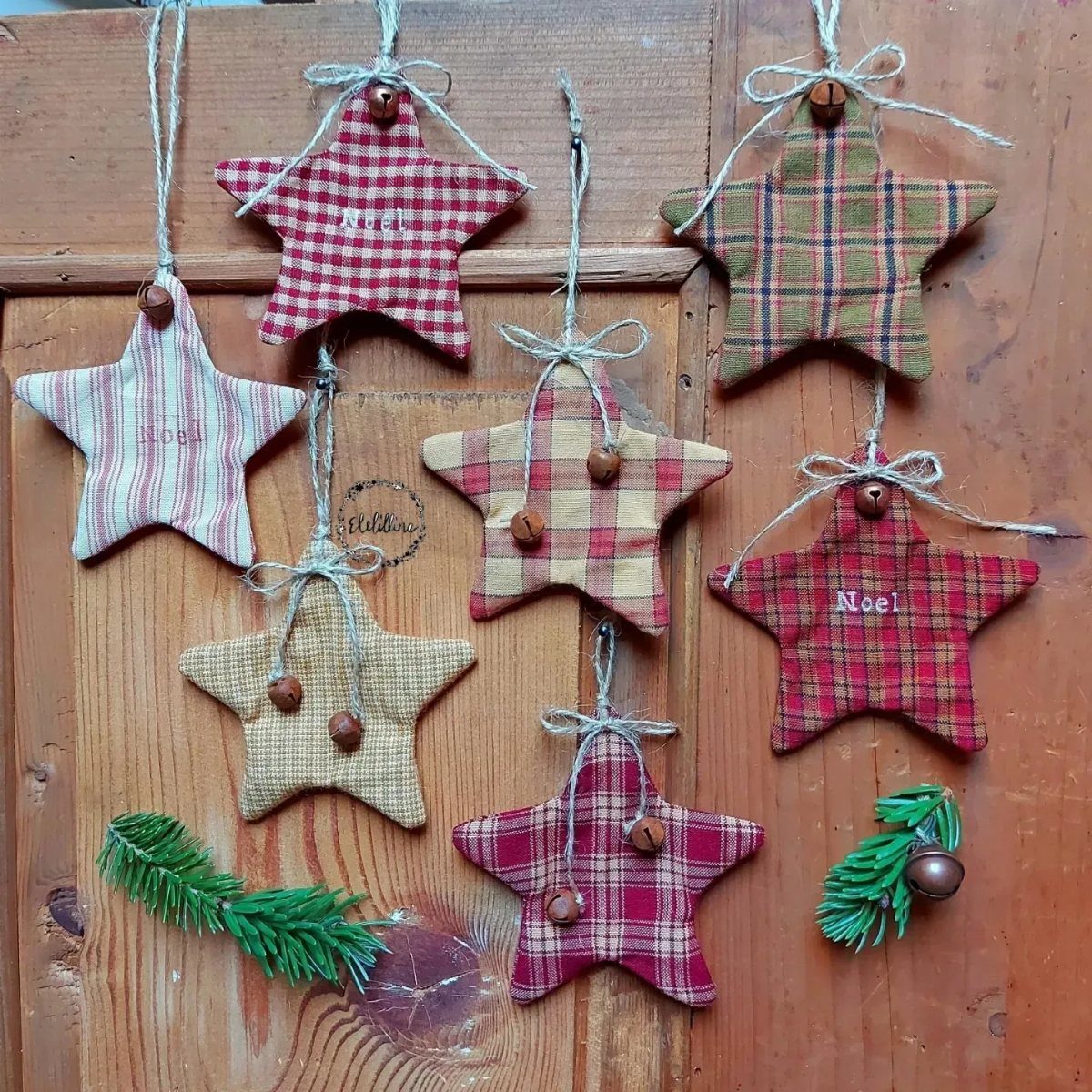 Homemade Christmas Ornament Ideas: 8 Easy Projects 5 Seven fabric star ornaments with plaid patterns hanging on a rustic wooden background.